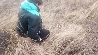 A Ukrainian Girl Urinates Outdoors Near A Tree, With Urine Flowing From Her Vagina