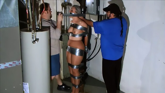 Amateur bondage: Hands bound with duct tape for a kinky distraction